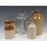 Two ceramic flagons, one marked 'Whiteways' on the lid, two ceramic jars with one glass flagon,