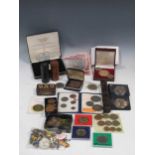 A collection of ephemera to include two WWI medals,a collection of coins, a 1934 badge to