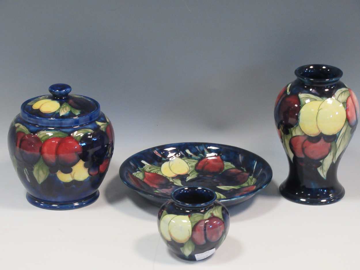 Two Moorcroft Wisteria pattern vases, a jar and cover and a dish, tallest 16cm high (4)The both