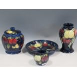 Two Moorcroft Wisteria pattern vases, a jar and cover and a dish, tallest 16cm high (4)The both