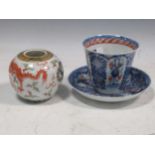 A 19th century Japanese blue and white cup, 7.5cm high, and saucer 14cm diameter, decorated with