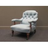 An Edwardian walnut armchair with blue button back upholsteryStructually the front legs have a bit