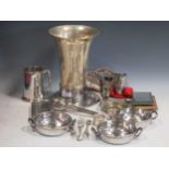 A collection of silver plated and metal wares, to include a large vase, a cased travel mirror,