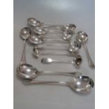 A collection of assorted silver flatware together with 2 silver sauce ladles and 2 silver toddy