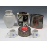 A collection of 20th century studio ceramics, to include two slab built vases, four mugs, a