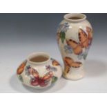 Two modern Moorcroft Butterfly pattern vases, tallest 26cm (2)