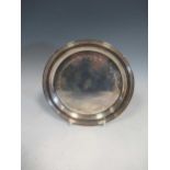 A silver waiter inscribed 'This salver commemorates the winning by Imperial ace of the sandown