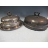 Two plated meat covers with armorial crests, and one oval dish