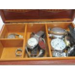 A jewellery box containing multiple watches, a hallmarked 18ct gold ring, and a ring stamped '18CT