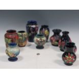 A collection of ten small Moorcroft vases (10)Slight scratches to some of the vases, and some
