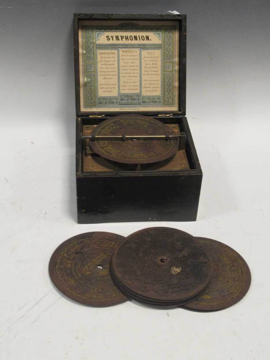 A small 19th century Symphonion 'Simplex' disc musical box with discs, in ebonised casePlaying a