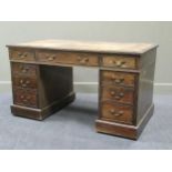 An Edwardian walnut pedestal desk, 76 x 137 x 76cm