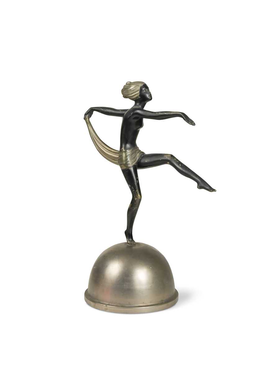 After Josef Lorenzl, a patinated and silvered spelter model of a scarf dancer,