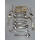 Two pairs of antique silver tongs and nips, and various small spoons etc. Six nut picks in the