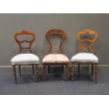 A pair of 19th century Continental inlaid walnut bedroom chairs, the shaped backs on turned front