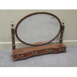 A George III style mahogany dressing table mirror with four drawer serpentine base, 110cm wide
