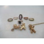 A hallmarked 9ct gold teddy bear pendant/chain, a hallmarked teddy bear brooch and six rings,