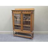 A 1940s glazed oak bookcase, 140 x 107 x 32cm