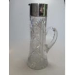 Silver topped glass jug