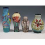 Three modern Moorcroft vases, including one with a Flamingo pattern and another with Dragonflies;