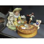 A bisque porcleain model of a young boy with a dog, a pottery game pie dish and cover, and various