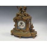 A Louis XVI style mantel clock, with sevres style floral painted porcelain dial and twin putti