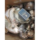 A large collection of silver plated items including bottle coasters, sauce boats, waiters,