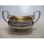 A silver two handled sugar bowl by R & S Hennell, 10ozt
