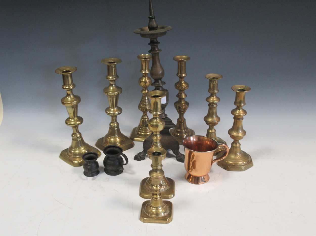 A collection of metal and pewter wares to include candle sticks, tankards etc