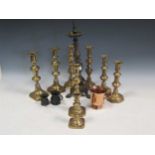 A collection of metal and pewter wares to include candle sticks, tankards etc