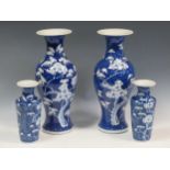 A pair of Chinese blue and white baluster vases, early/mid 20th century with pseudo marks 35cm high,