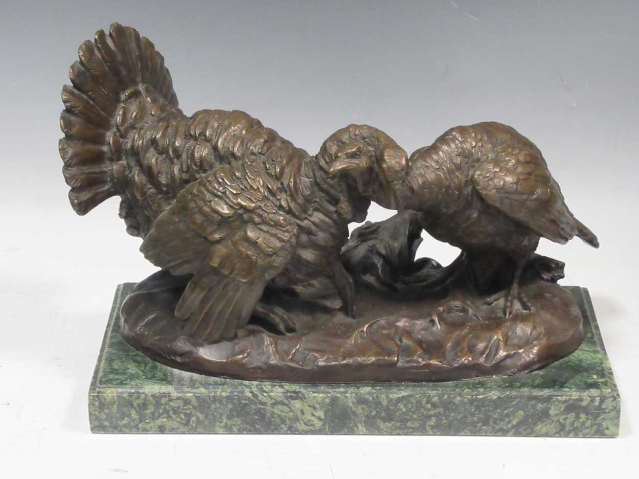 A bronze brace of Turkeys, signed 'Bazan', on a green stone base, 23 x 33 x 18cm, including base