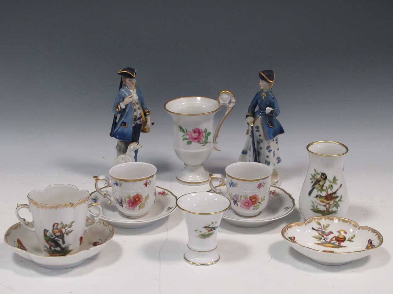 Items of German porcelain to include a two-handled cup and stand, two vases, two cups etc; a pair of