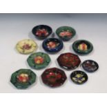 Five Moorcroft octagonal ashtrays and six other small Moorcroft dishes