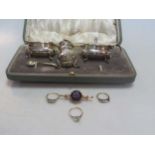 a hallmarked 9ct gold three stone diamond ring, a white stone ring tested as 9ct gold, an amethyst