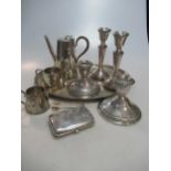 A collection of silver items including tray, three piece set, cigarette case, candlestickes etc 26.