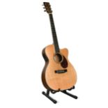 A Martin & Co. OMC-16OGTE acoustic six-string guitar,