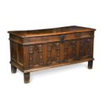 A four panelled oak coffer, late 18th century,