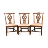 A set of three fruitwood dining chairs, 18th century,