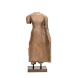 A Khmer sandstone standing female torso, perhaps 11th/12th century,