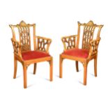 A pair of Chinese Chippendale revival painted satinwood elbow chairs, early 20th century,