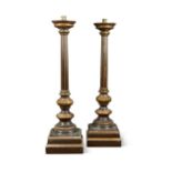 A large pair of brown and gilt painted pricket candle stands, early 20th century,