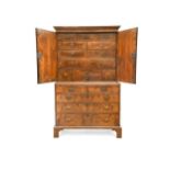 A George I walnut and feather banded cabinet on chest,