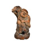 A Chinese bamboo carving of Liu Hai and the greedy toad, Qing Dynasty, 19th century,