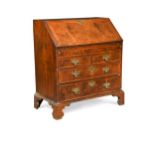 A walnut and feather banded bureau, 18th century,