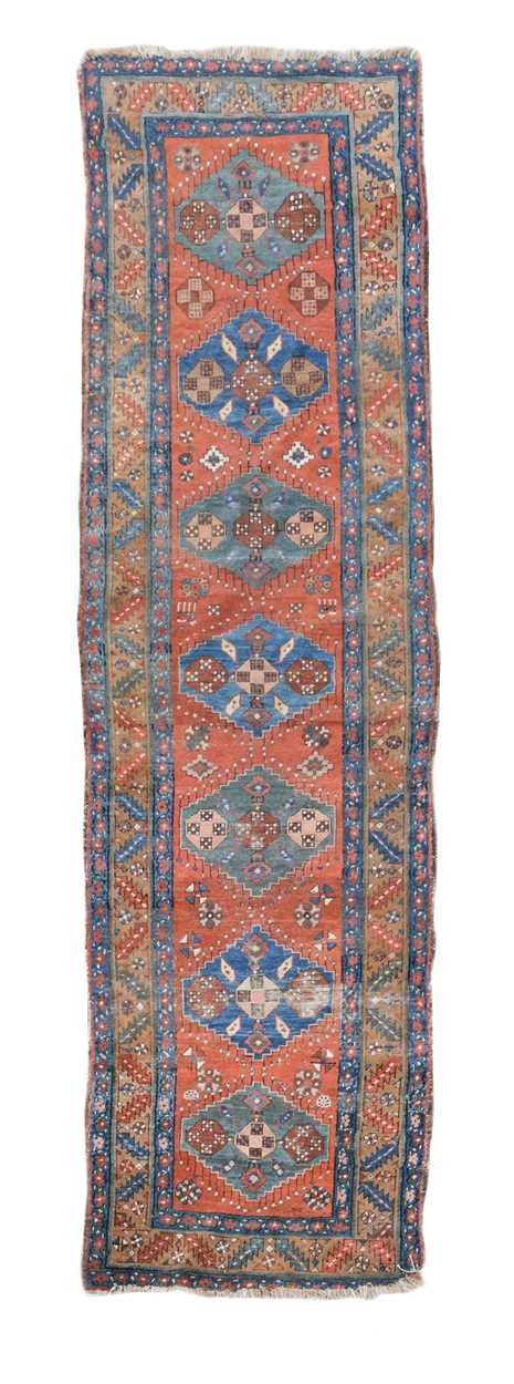 Antique heriz runner, circa 1900 384 x 101cmLow pile and large areas of wearLosses to the selvage