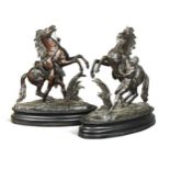 After Guillaume Coustou (1677-1746), a large pair of bronze 'Marly Horses',