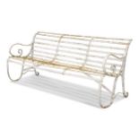 A white painted wrought iron garden bench, late 19th century,
