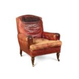 A late Victorian walnut leather armchair,