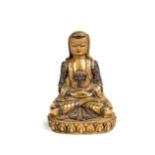 A Tibetan gilt bronze seated figure of a lama, early/mid 20th century,